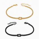 Knot Armband-Set Gold und Schwarz auf weißem Hintergrund