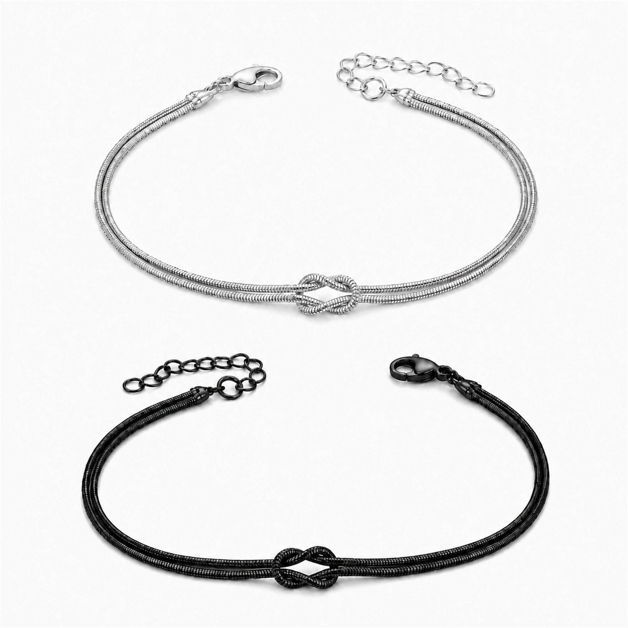 Knot Armband-Set Silber und Schwarz auf weißem Hintergrund